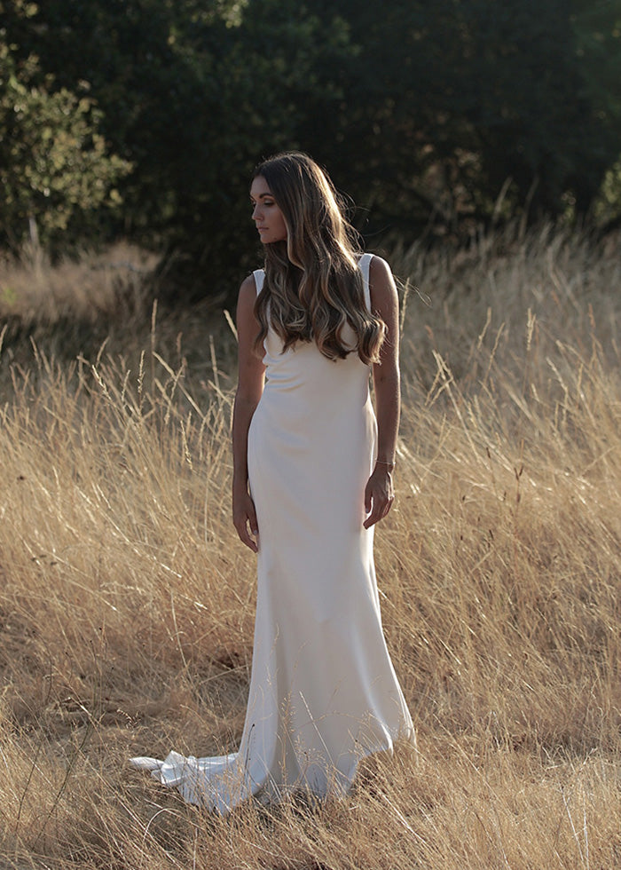  Ivory V-neck fit and flare gown worn by bride for outdoor summer wedding designed by best wedding  designers