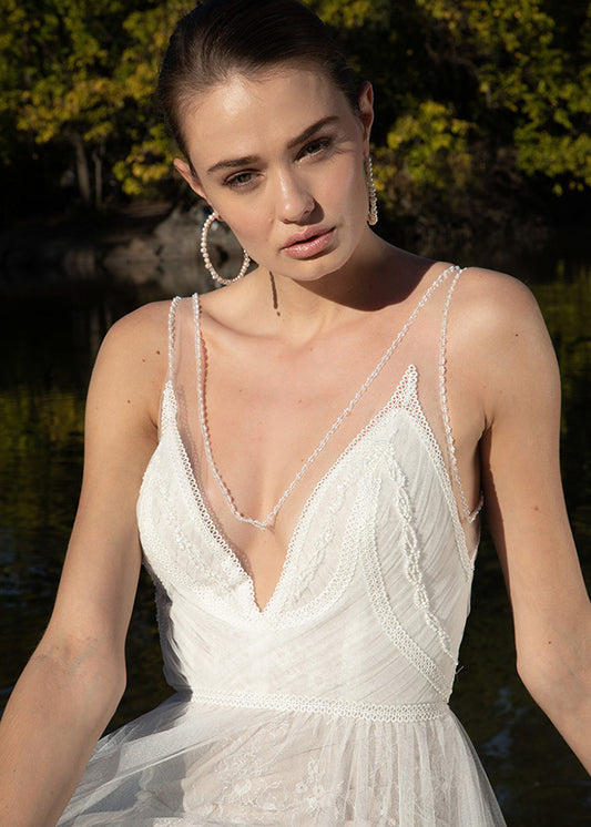 Model wears boho wedding hippy style wedding dress