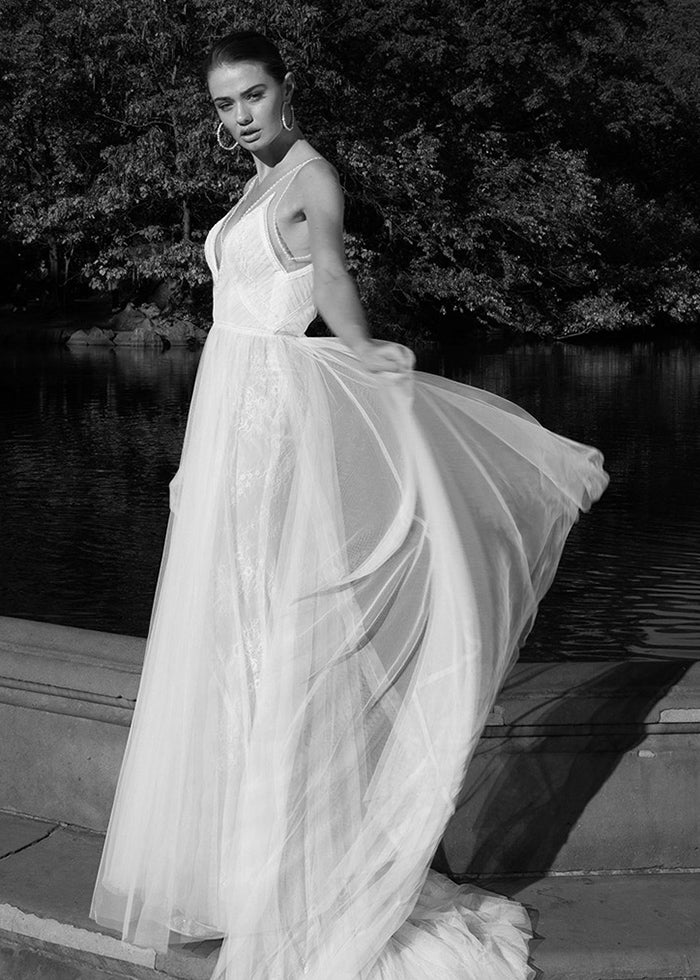 Model twirls in luxury custom made wedding dress made by the best wedding designers