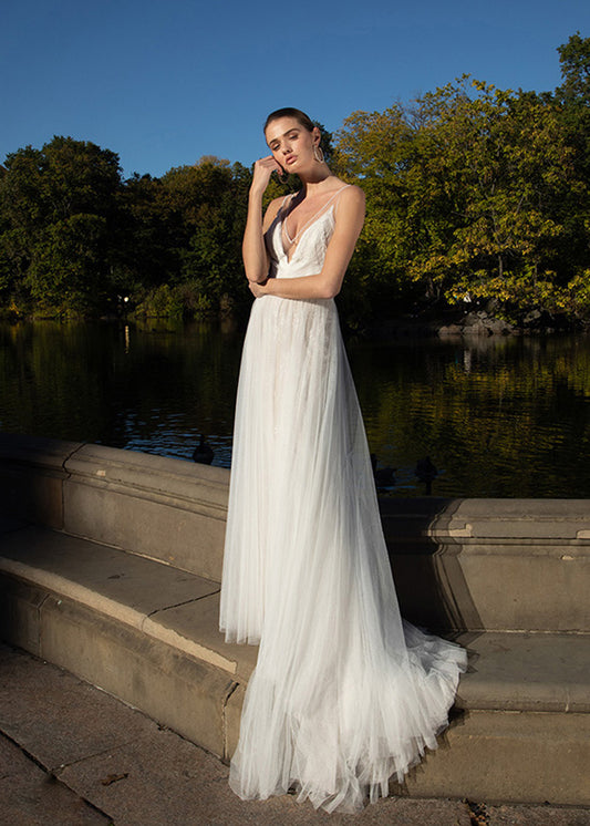 Model wears bohemian style romantic wedding  dress