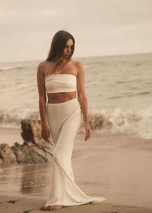 Bride wears fluted crepe bridal skirt to complete her bridal outfit look for summer wedding
