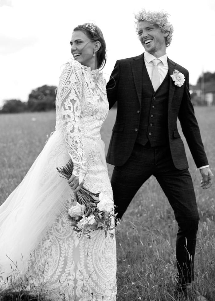 Bride wears hippy style wedding dress with detachable wedding skirt
