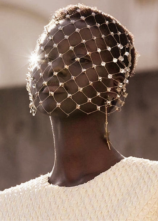model wears Swarovski Crystal encrusted delicate English birdcage veil with wide diamond pattern netting 