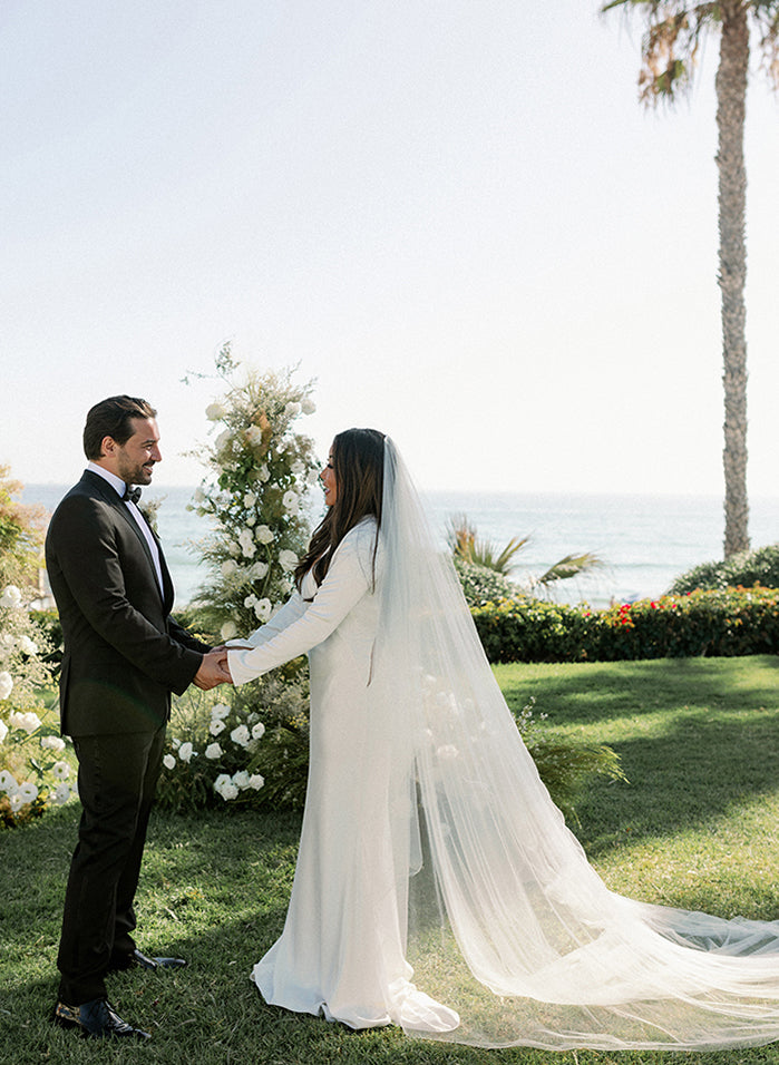 Bride wears Unique, luxury, one of a kind wedding dresses and drop veil